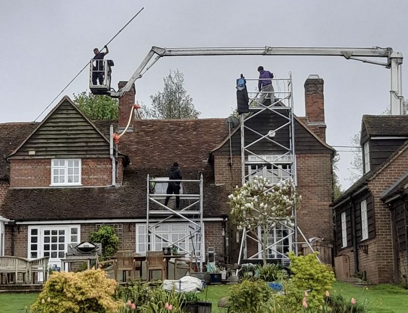 The Roof Moss Cleaners using cherry picker and scaffolding to clean roof safely and professionally in Cricklade, Wiltshire