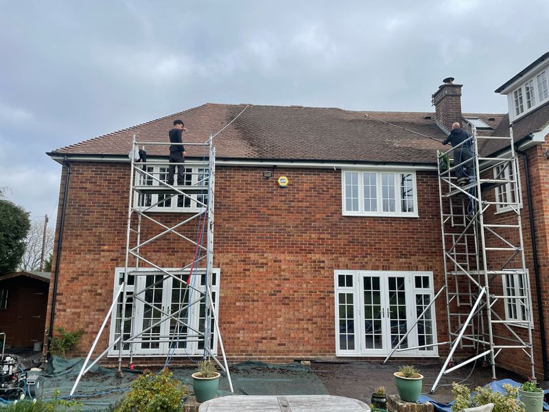 Roof cleaning carried out safely from scaffold towers by The Roof Moss Cleaners in Cricklade